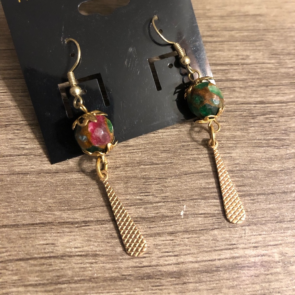 Gold and multi color stone.